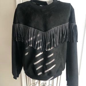 Black long sleeve shirt with fringes on the sleeve and front of shirt
